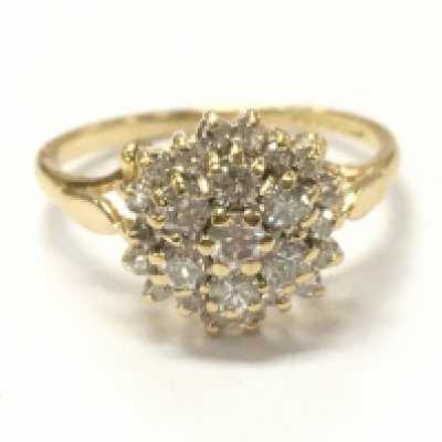 An 18ct gold diamond cluster ring, size I. 2.3G total weight. Postage category A