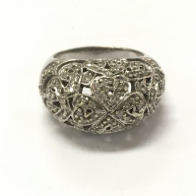 A 9ct white gold diamond four leaf clover ring, 9.7g total weight. Postage category A