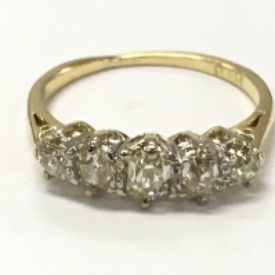 An 18ct gold 5 stone old cut diamond ring, size M. 2.6g total Weight . Postage category A