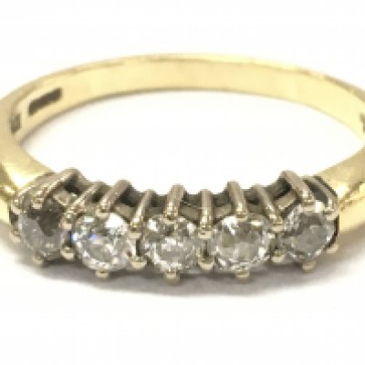 An 18ct gold 5 stone diamond ring , size U, 5.3g . Postage category A