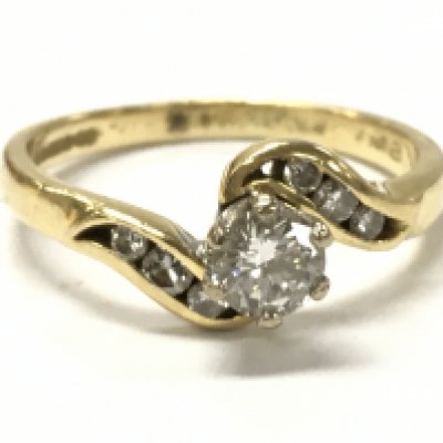 18ct gold diamond twist ring size O, 3g total weight . Postage category A