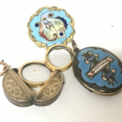 An enclosed locket with double oval portrait an enamel brooch made in Paris and a similar enclosed locket (3)