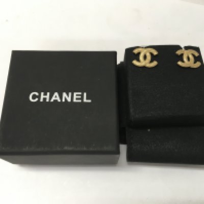 A pair of boxed channel earrings.