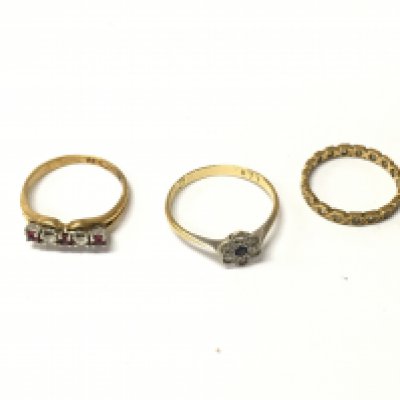 Three 18ct marks rings set with stones. Approx weight 6.82 grams.