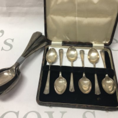A set of six silver spoons and a cased set of six silver tea spoons. 315 grams.
