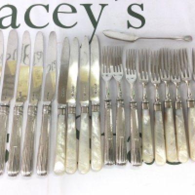 A collection of silver knives and forks. Shipping category B.