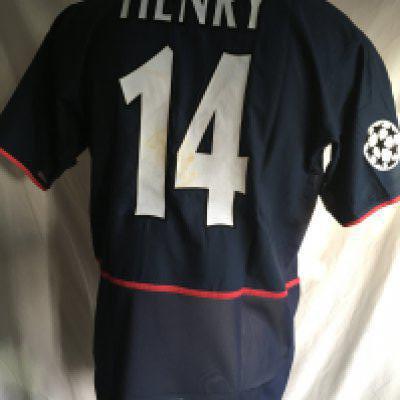 Thierry Henry Arsenal Match Worn Football Shirt: 2002/2003 blue short sleeve shirt with Champions League badging to right arm and 14 Henry to rear. C/W signed card by Henry stating I wore this shirt v Roma on 27 11 2002. Also 3 pictures of him wearing the shirt that evening. Please note only a few pieces of the annoying inner mesh are left as it was common for players to cut it out.
