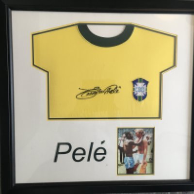 Pele Signed Framed Football Shirt: Quality genuine item signed on yellow Brazil shirt Edson Pele. Famous picture of him at the World Cup with Bobby Moore.
