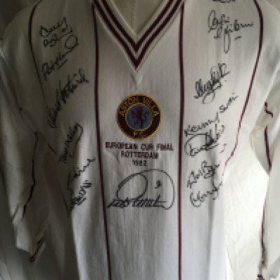 Aston Villa Fully Signed 1982 European Cup Final Shirt: Replica long sleeve shirt with identical European Cup Final Rotterdam 1982 stitching to front of white shirt. Hand signed in black marker pen by 14 of the squad including Swain, Evans, Withe, Morley, Mortimer and Bremner.