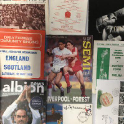 Football Programme + Memorabilia Box: Includes some interesting programmes worth a glimpse. C/W signed FDCs including J Charlton Greaves Busby Hurst Greenhoff Banks a menu signed by Charles Buchan plus many teams sheets and more.