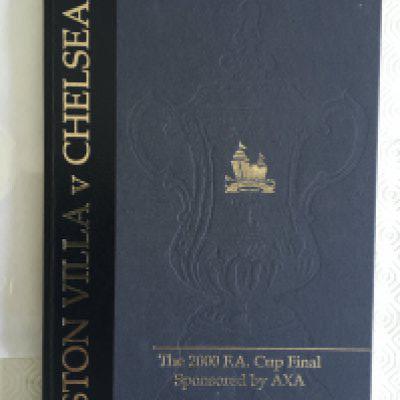 2000 FA Cup Final Chelsea Hardback Signed Final Programme: Black FA Cup final hand signed by the entire winning Chelsea squad that day. All genuine autographs signed next to identified name and number plus management. for players on official sheet stuck in. Last FA Cup final at the old Wembley. Hardback Ltd edition programme. Autographs include Vialli Wilkins Di Matteo Wise Zola Terry in fact 19 in total.