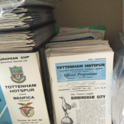 Tottenham 1960s Home Football Programmes: Many hundreds in good condition with some full sets C/W 11 handbooks from the 60s onwards. Duplication. Quantity in box. C/W large signed print of Tony Marchi with ECWC, signed + mounted Hoddle + Mullery display.