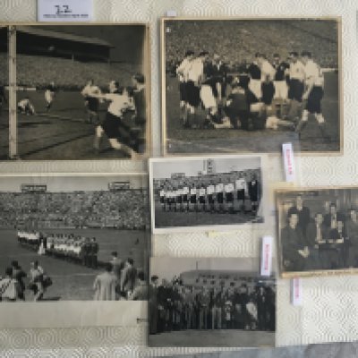 England 1940s Football Press Photos: Two match action at Hampden Park in 1946 and a smaller one of the England team at the hotel without press stamp. Postcard size of the England team and a larger one of both teams lining up in Italy 1948. Postcard size of the squad outside aeroplane in Switzerland 1947. Press stamps and information to rear unless stated with 3 having discreet punch holes to border. (6)