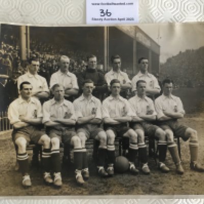 1922 England Team Press Photo v Scotland: Original 10 x 8 inch press photo picturing all 11 players in kit on the pitch at Villa Park before the match with Scotland. Press stamp and players identified to rear. Very good with tiny piece out of border.