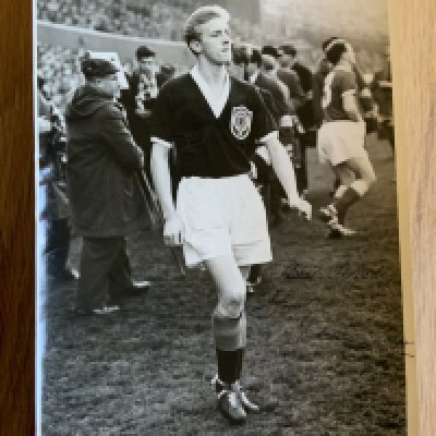 George Best + Denis Law Signed Football Picture: Large colour magazine picture featuring both Manchester United players in their respective Scotland and Northern Ireland kits. Both clearly hand signed without dedication. Measures just over 8 inches square.