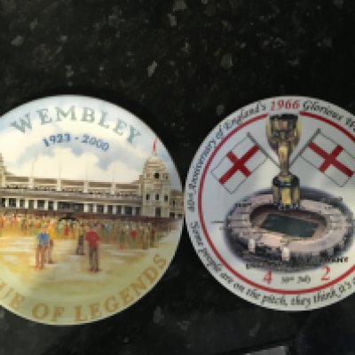 1966 World Cup + Wembley Decorative Plates: Tea plate size, one depicting Wembley and the World Cup with winning squad names to front and results of matches to rear. Other plate has picture of Wembley with title Venue Of Legends 1923-2000. Both made in the millennium and excellent. (2)