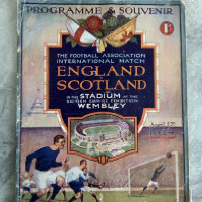 1924 England v Scotland Football Programme: Wembley became the home of England and this was the first International played at under the twin towers. Fair condition with fifty per cent split to spine. Completely original with no repairs or writing. Rare item.