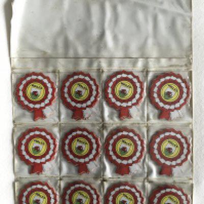 BABS Wales Shop Display Of Rosette Cards: 120 rosette shape Wales Football cards in shop display showing 12 identical cards. Each pouch contains 10 cards. (120)