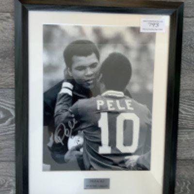 Pele + Muhammad Ali Signed Framed Football Photo: Black and white photo with matching frame and mount measuring 22 x 17 inches. Plaque states Sporting Greats and comes with COA from Sporting Moments. Signed by Pele only.