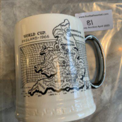 Rare 1966 World Cup Ceramic Tankard: The rare one made by Moslem of Stevenage, although this is not stated. Beautifully made with silver coloured handle and trim. One side depicts the 8 venues to be used and the other the 16 participating nations. 100% original in stunning condition. Base reads Britannia Designs.