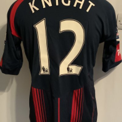 Bolton Wanderers 2009 - 2010 Match Worn Football Shirt: Blue short sleeve with Premiership badging to arms. Number 12 Knight to rear.