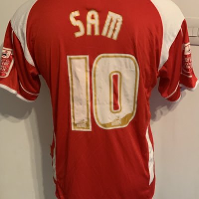 Charlton 2007 - 2008 Match Worn Football Shirt: Red short sleeve with Coca Cola badging to arms. Number 10 Sam to rear. Signed to front by the squad.