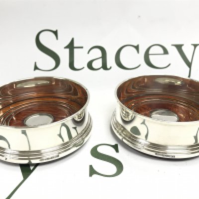 A pair of silver Hallmarked coasters, postage category B