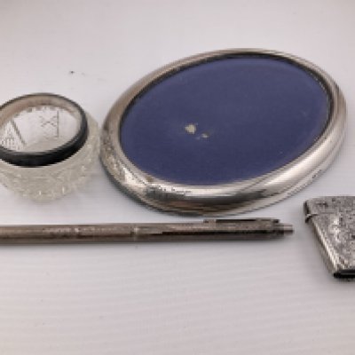 A collection of silver items. Postage category A.