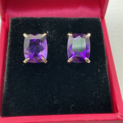 A pair of 9ct yellow gold earrings set with amethyst. Postage category A.