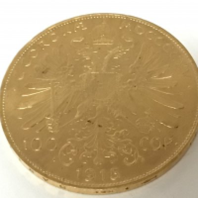 A 1915 gold Austrian 100 Corona coin with the side profile of Francis Joseph I.weight 33.9g