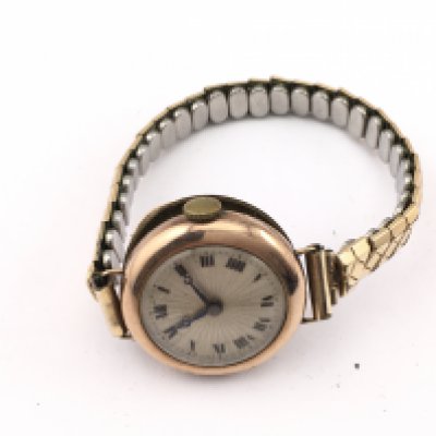 A 9ct gold cased vintage wrist watch. Postage A