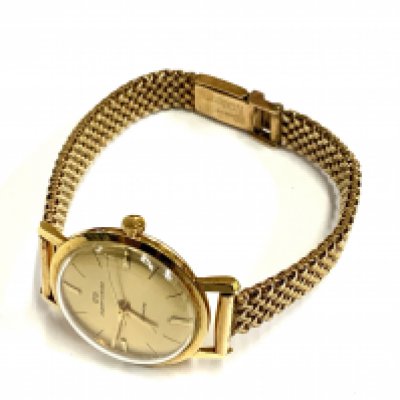 A vintage Jaquet + Girard 18ct gold cased ladies wrist watch together with a 9ct gold strap. 28.93g (A)