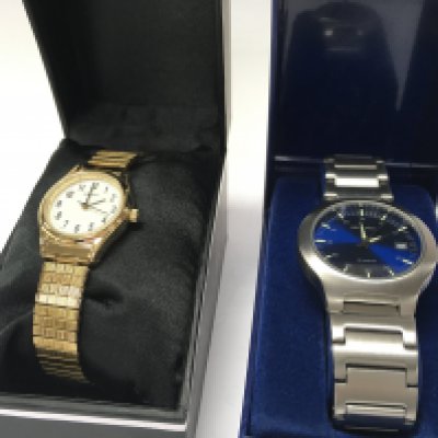 Two boxed Sekonda quartz watches Comprising a mens blue face date watch and a ladies gold tone watch. Postage category B
