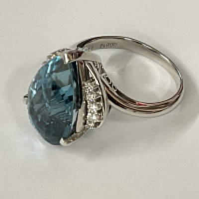 Large and weighty certificated platinum ring set with a mixed pear cut deep blue topaz and RBC diamonds. Topaz 13.72ct. Diamonds 0.28ct. Cert no. WG19624148355. Approx ring size Q/R. Postage category A.