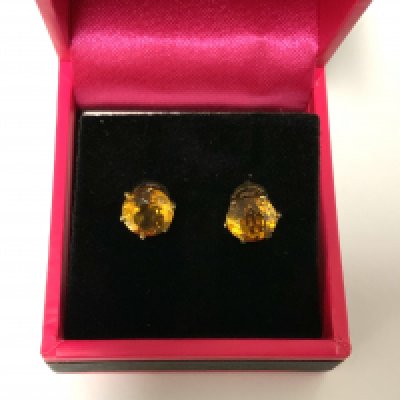 A pair of 9ct gold Spessartite garnet stud earrings (A)
