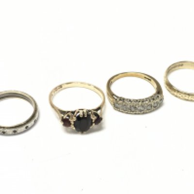 A Collection of 9ct gold rings including a Moissanite ring, ruby set ring, 9ct gold/silver ring. Total weight 9.5g. Postage category A