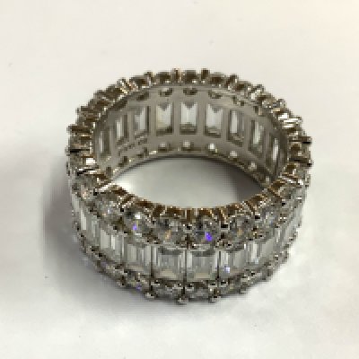 A steering silver and CZ eternity ring. Size S. (A)