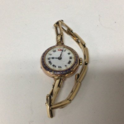 A Vintage 9carat gold ladies watch with an expanding Rolled Gold strap bracelet not seen working