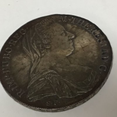 A silver Austrian 1780 Theresa Maria SF coin.