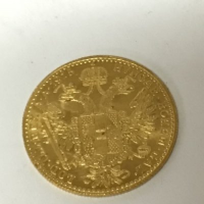 A gold Austrian coin dated 1915 depicting Francis Joseph I weight 3.5g