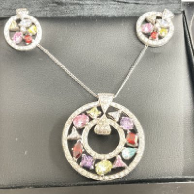 18ct gold 3 piece set, on 18ct chain. 2.83g, screw back earrings, 4ct 59 total diamond weight. Postage category A.