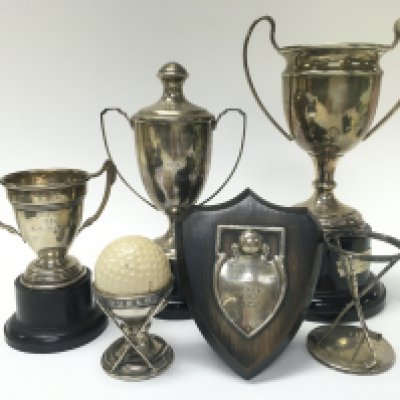 A Collection of silver hallmarked trophies. 5 to 20cm tall approximately. Postage category B
