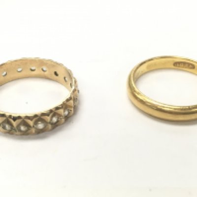 A 22ct gold band and a 9ct band (eternity). Total weight 5.6g. Size J and L. Postage category A