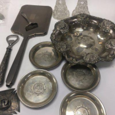 A Collection of silver including four dishes , perfume bottles ( no stoppers ) hand mirror bottle opener medallion and penknife.
