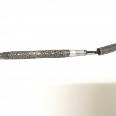 An early example of a silver cased fountain ink plunger pen onoto delerue with an outer silver case London 1912 hallmarks maker D L R Ltd.