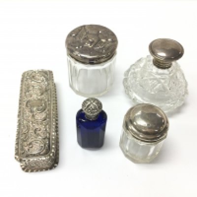 A collection of silver items including perfume bottles table jars etc. Postage D