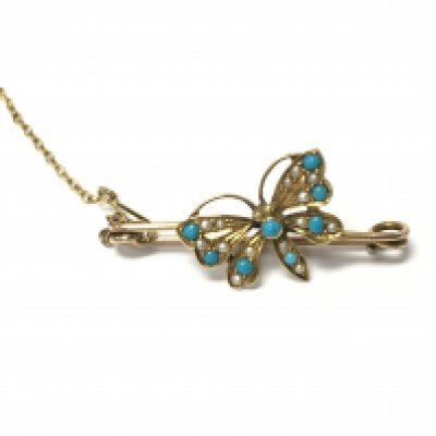 A gold brooch in the form of a butterfly set with turquoise. Approximately 40mm and 2.79g