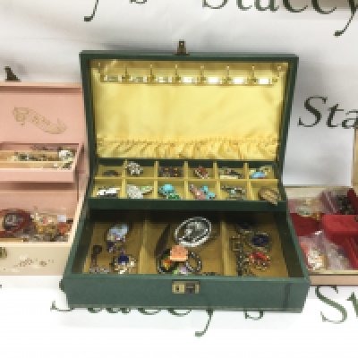 Three jewellery boxes containing various costume jewellery items. Shipping category C.