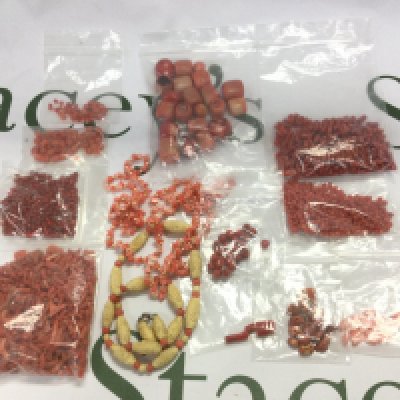 A collection of coral beads. Shipping category A.