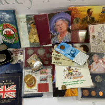 A collection of presentation and commemorative coin sets. (B)